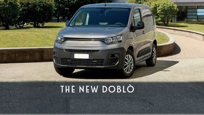 new fiat doblo van banner - grey colour parked 