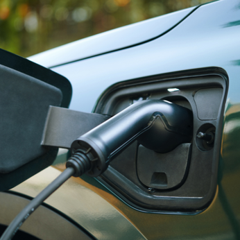 What is the new Electric Vehicle Pay-Per-Mile Tax Announced in the Budget?