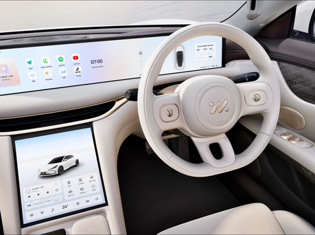 Image of interior of IM5 including steering wheel and touch screens.