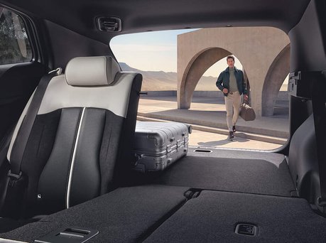 Image of the Kia Sportage inside with seats down highlighting space.