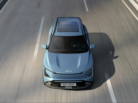 Image from above of the Kia EV5 driving.