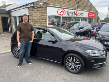 Alex from Leeds collecting his new Volkswagen Golf.