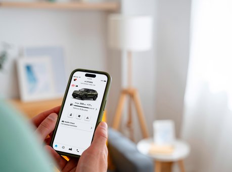 Image of someone on the mobile Suzuki app.