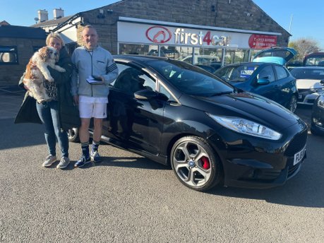 Andrew his wife and dog collecting their new car
