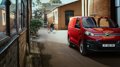 red new citroen dispatch - parked near building