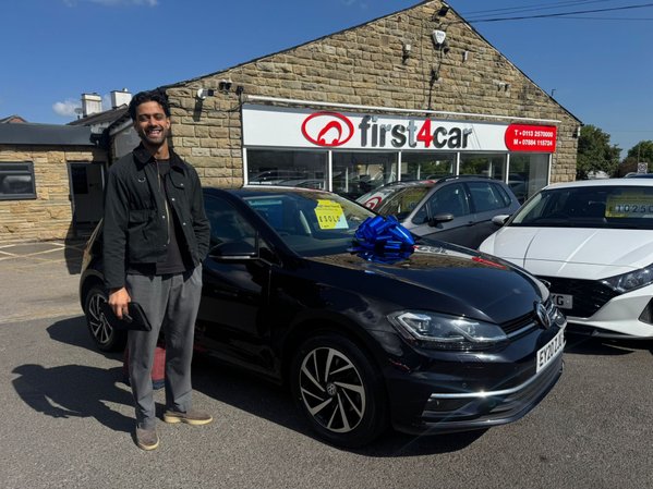 Ahmed from Bradford collecting his first car a Volkswagen Golf
