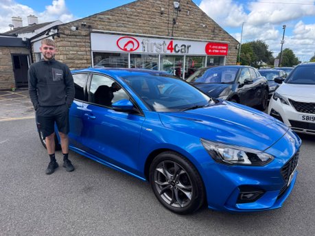 Rhys collecting his new Ford Focus.