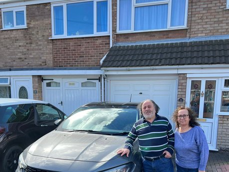 Happy customers receiving their new car in Cannock