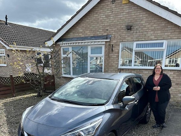 Heather receiving her new car in York