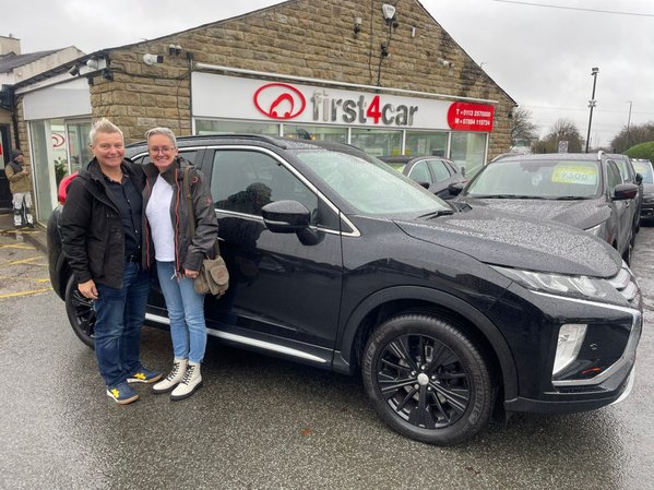 Victoria and her Partner collecting their new Mitsubishi Eclipse.