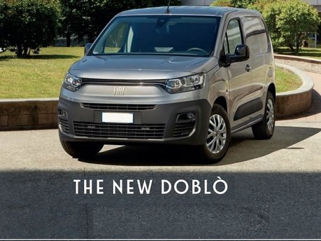 new fiat doblo van banner - grey colour parked