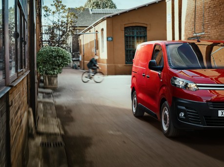 red new citroen dispatch - parked near building