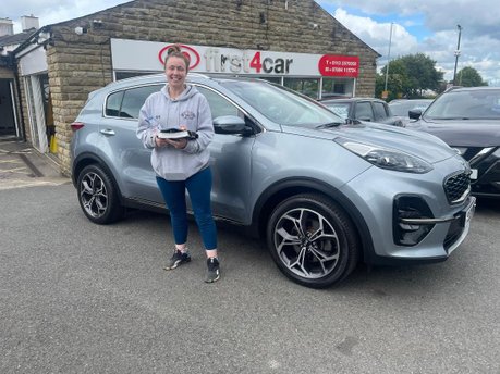 Katie from Leeds collecting her new Kia 