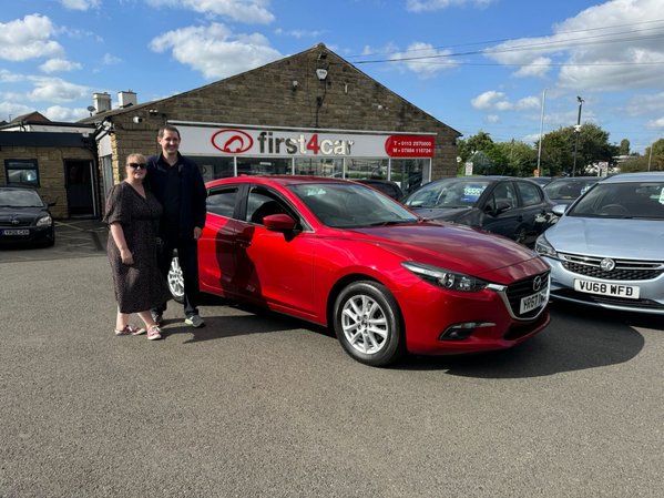 Daniel and Justine from Bradford collecting their new Mazda 3.