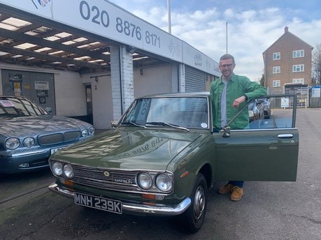 Very happy customer collecting his Datsun 510 Bluebird