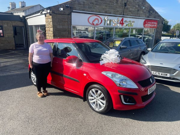 Amber from Leeds collecting her First car a Suzuki Swift 